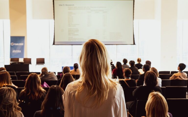 women standing up in a conference